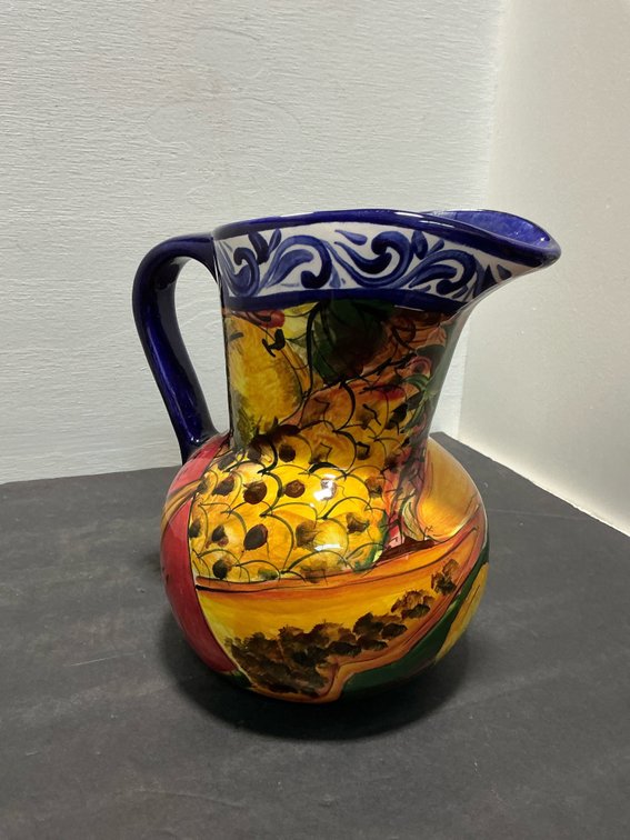 Hand-painted ceramic pitcher with fruit motif