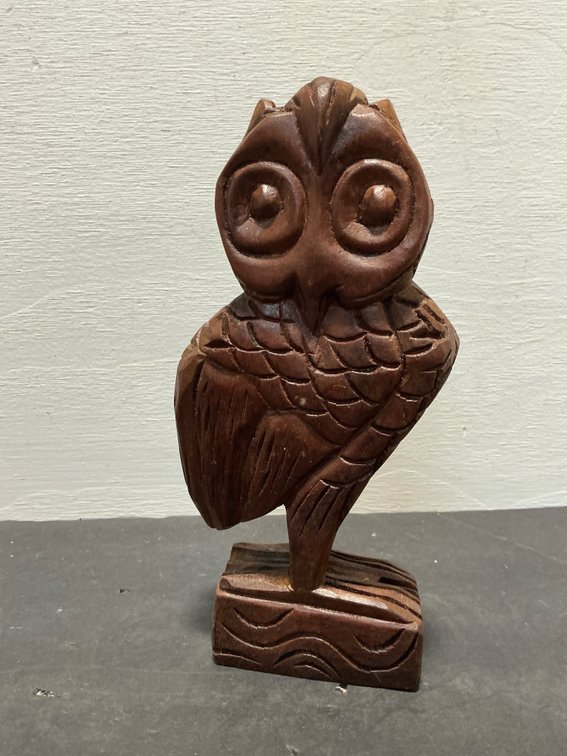 Carved wood owl figurine on rectangular base