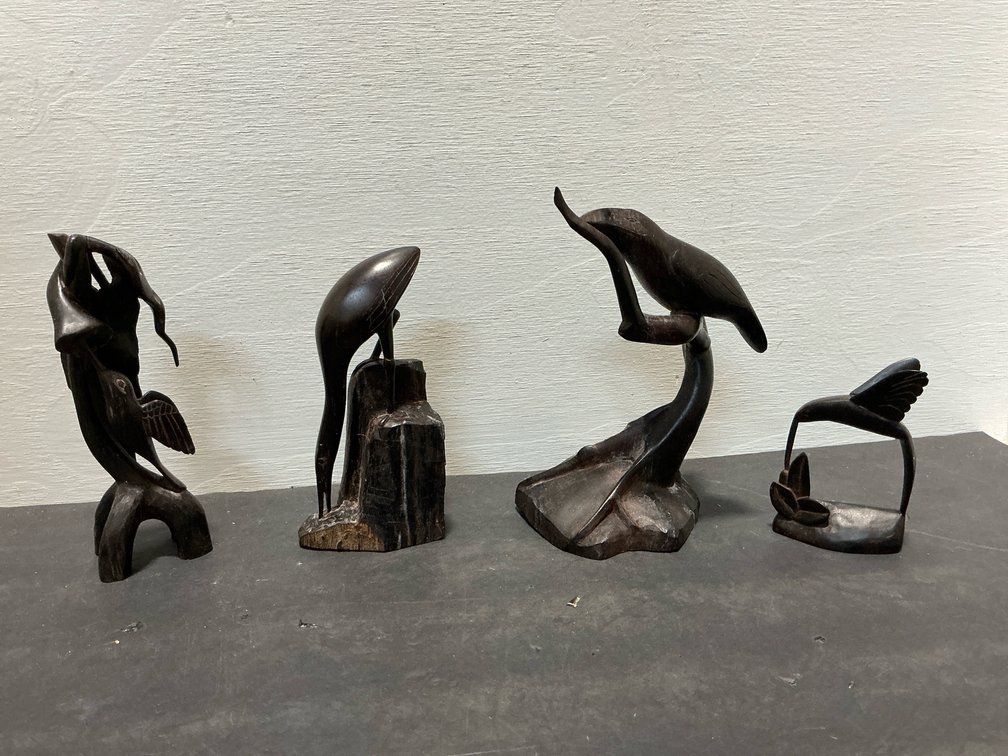 Carved dark hardwood bird sculptures