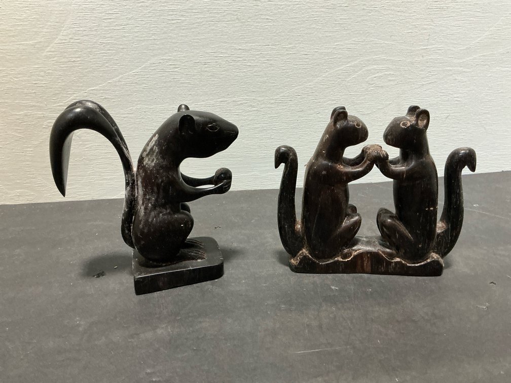 Carved dark wood squirrel figurines