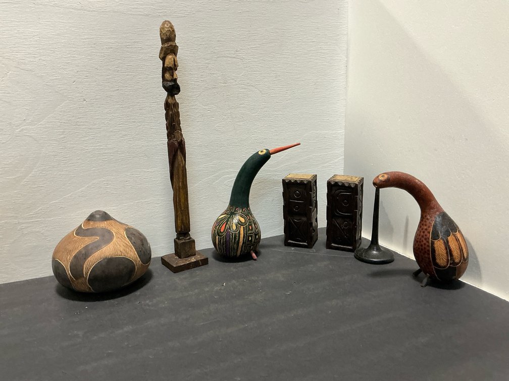 Grouping of carved folk art gourds & wood decor
