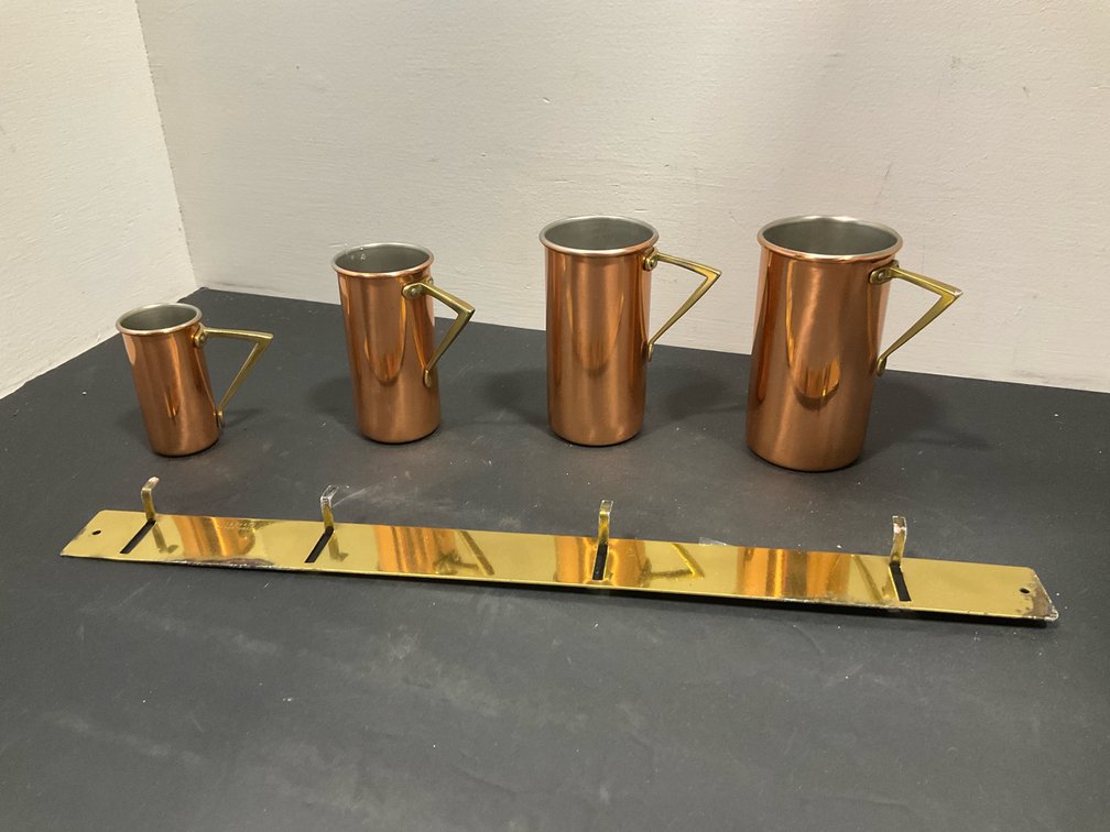 Set of Tagus copper measuring cups with brass rack