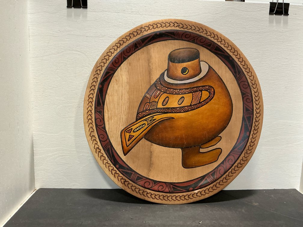 Carved and painted wood plate with bird motif
