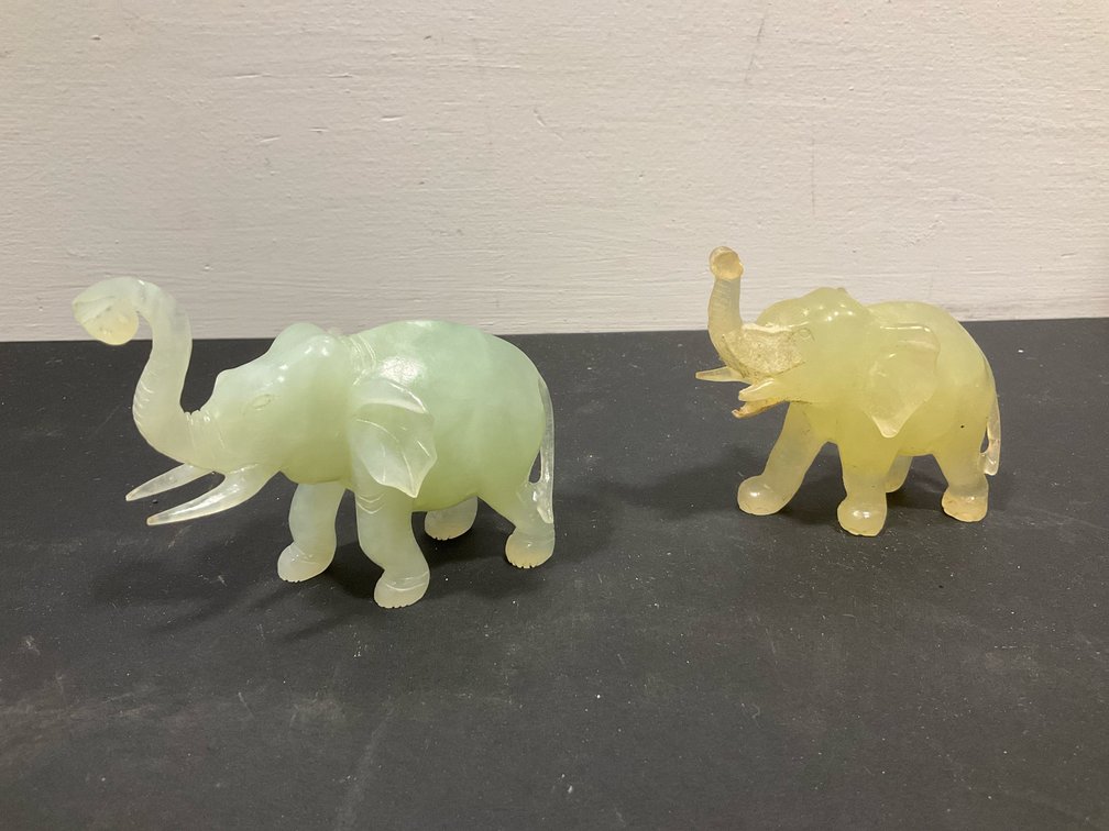 Pair of carved translucent elephant figurines
