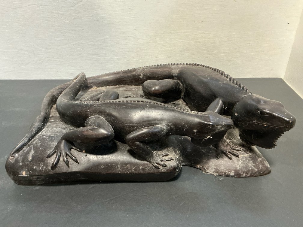 Carved dark wood two-iguana sculpture