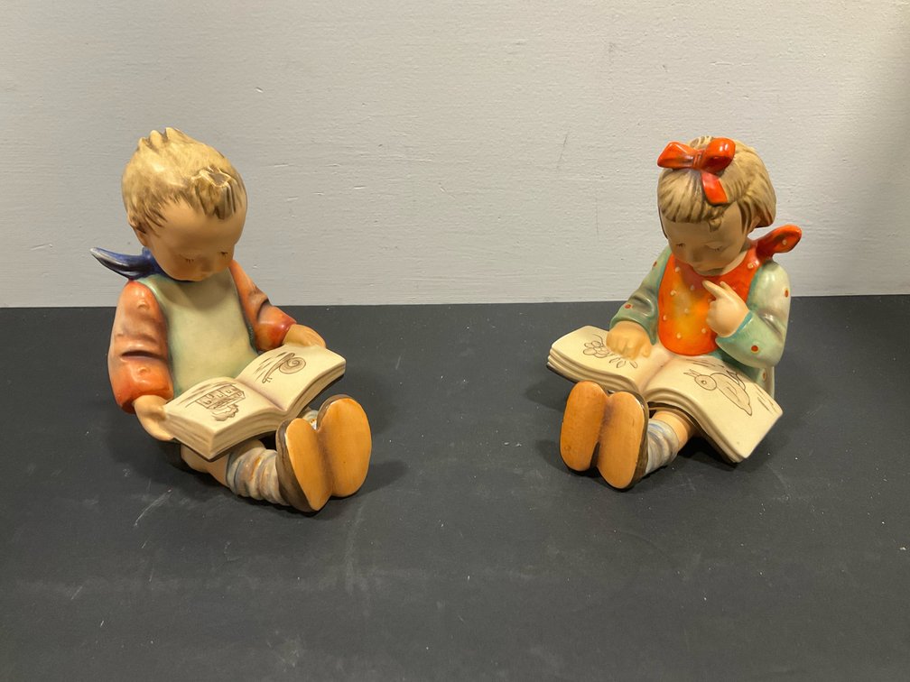 Pair of Goebel ceramic figurines of children reading