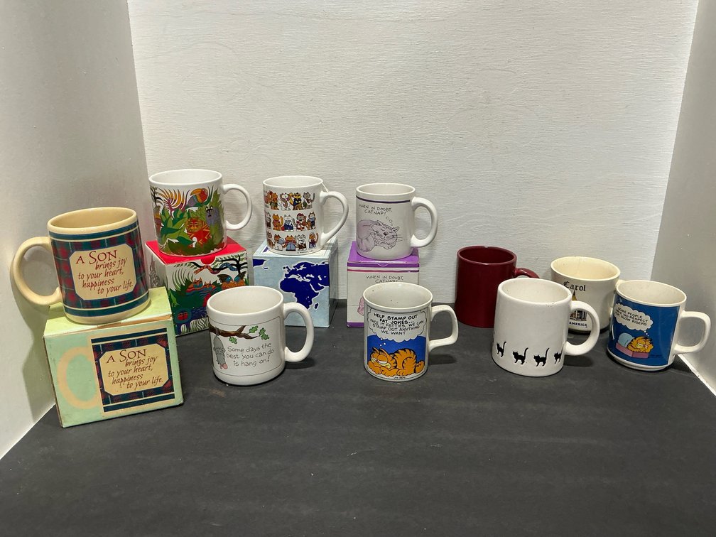 Assorted novelty ceramic mugs with boxes