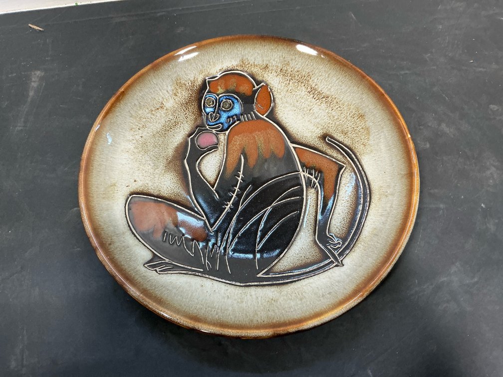 Glazed ceramic plate with monkey motif