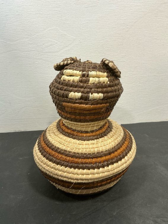 Coiled woven fiber animal-form basket