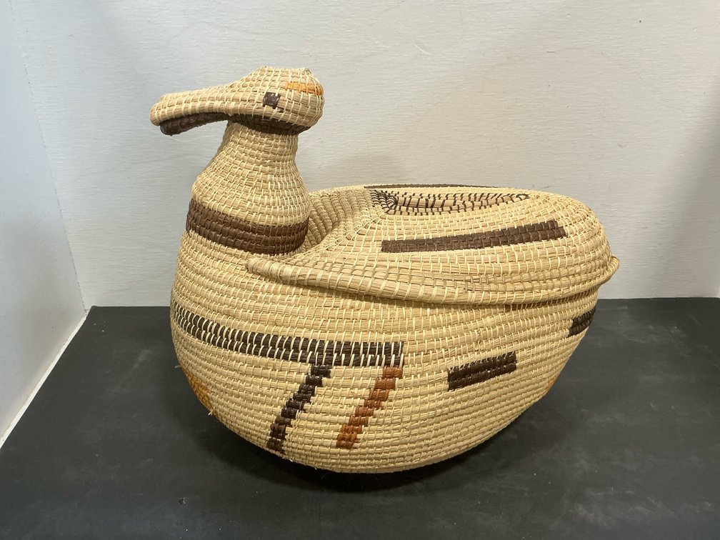 Coiled woven animal basket