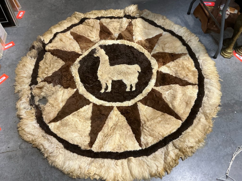 Round patchwork fur rug with llama motif, 58 in