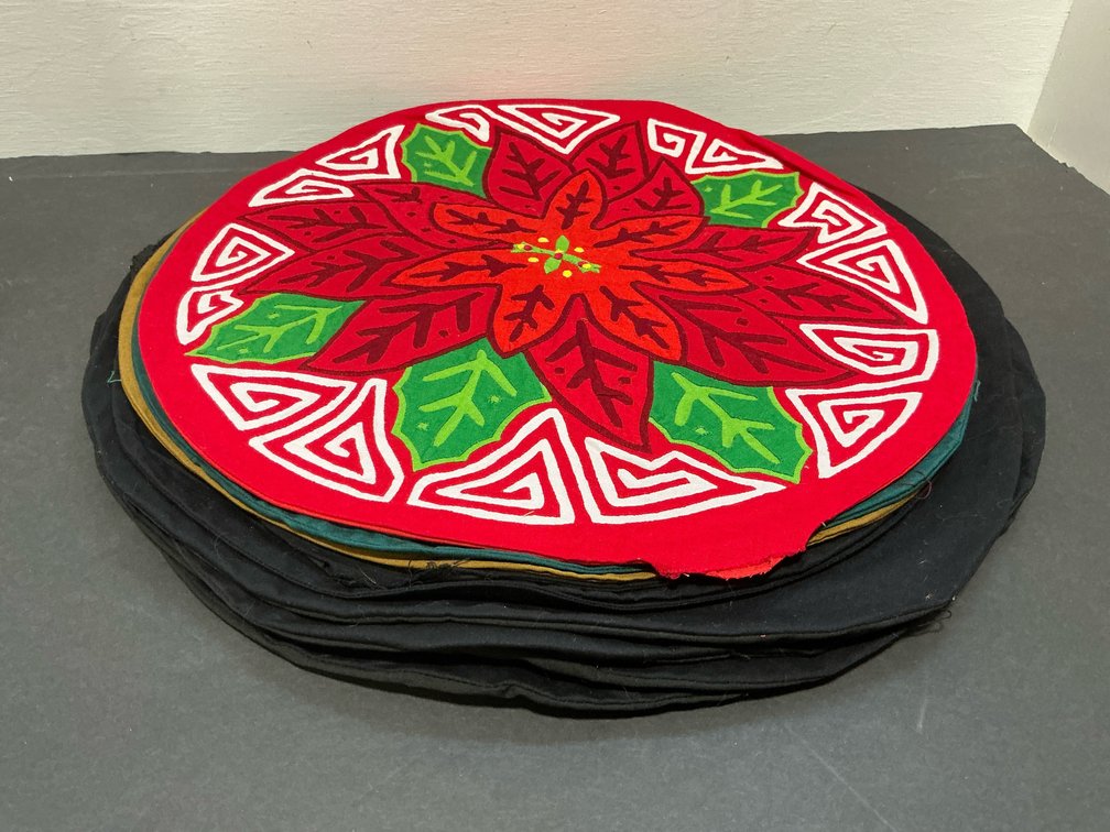 Grouping of round mola applique fabric mats