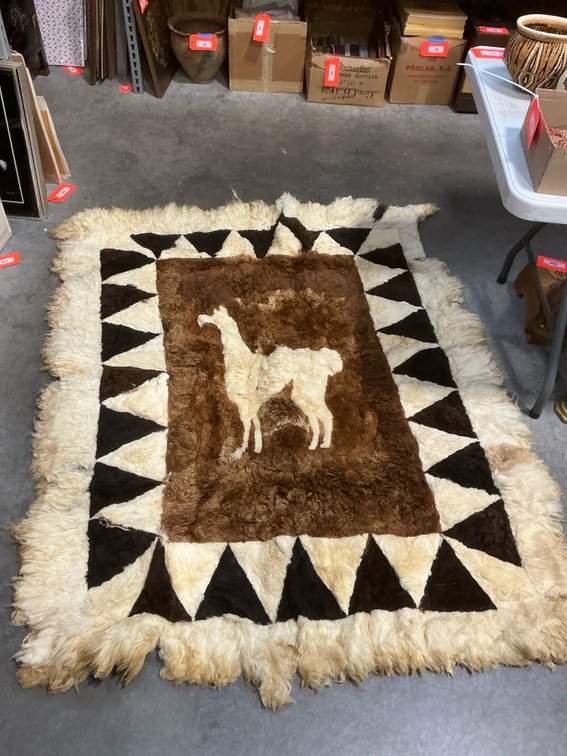 Pieced fur rug with llama motif, 51 x 70 in