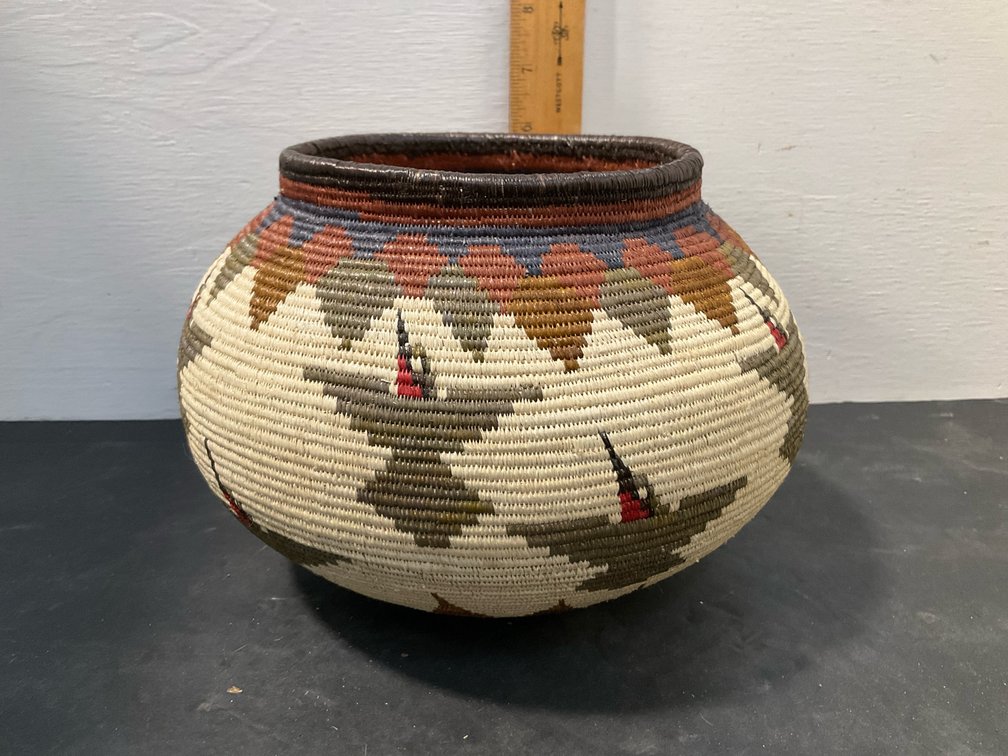 Polychrome coiled woven basket jar with bird motifs