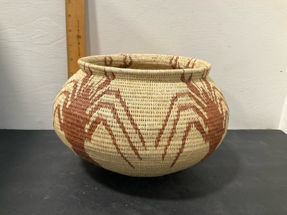 Coiled woven basket with geometric & figurative designs
