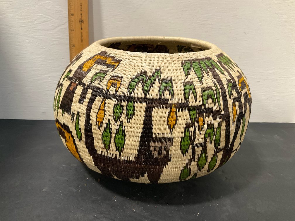 Globular coiled pictorial fiber basket