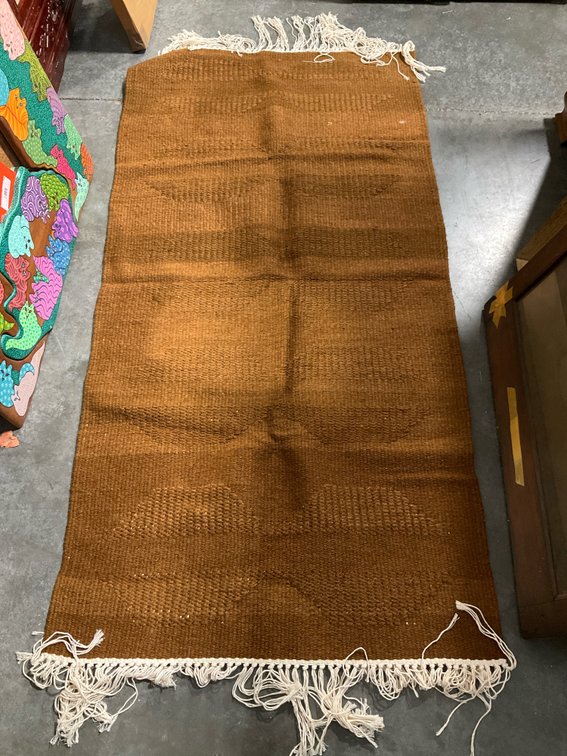 Brown woven runner rug with white fringe, 33 x 66 in