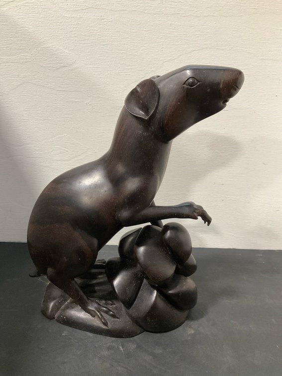 Carved dark hardwood standing animal figurine