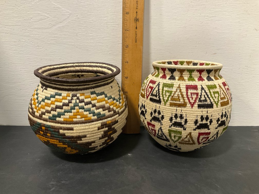 Pair of polychrome coiled woven baskets
