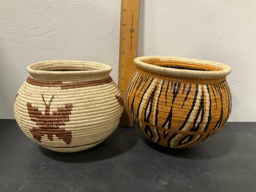 Pair of coiled woven baskets with butterfly & stripe motifs