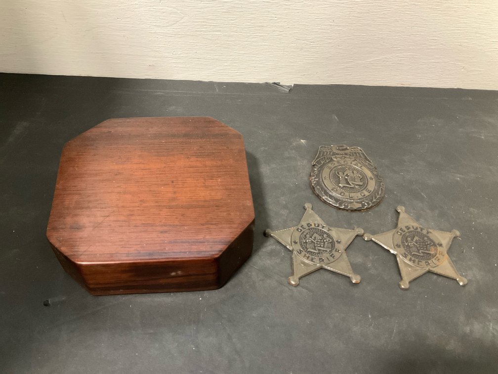 3 metal police & sheriff badges with wooden base