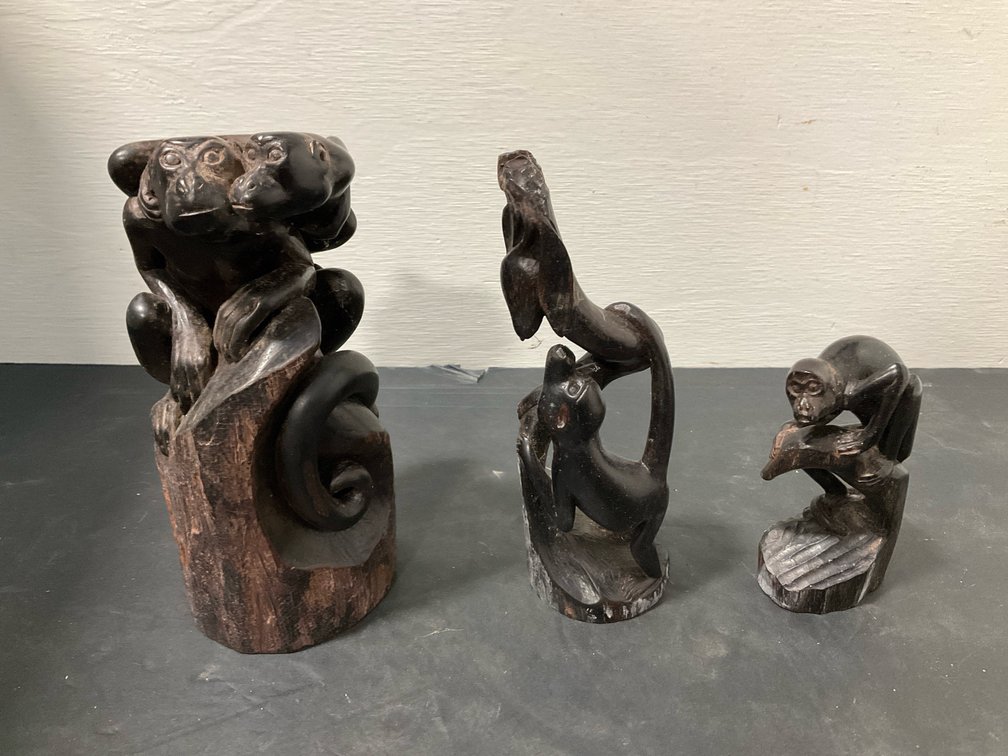 Carved dark wood monkey sculptures