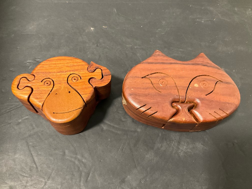 Pair of carved wood cat & monkey puzzle boxes