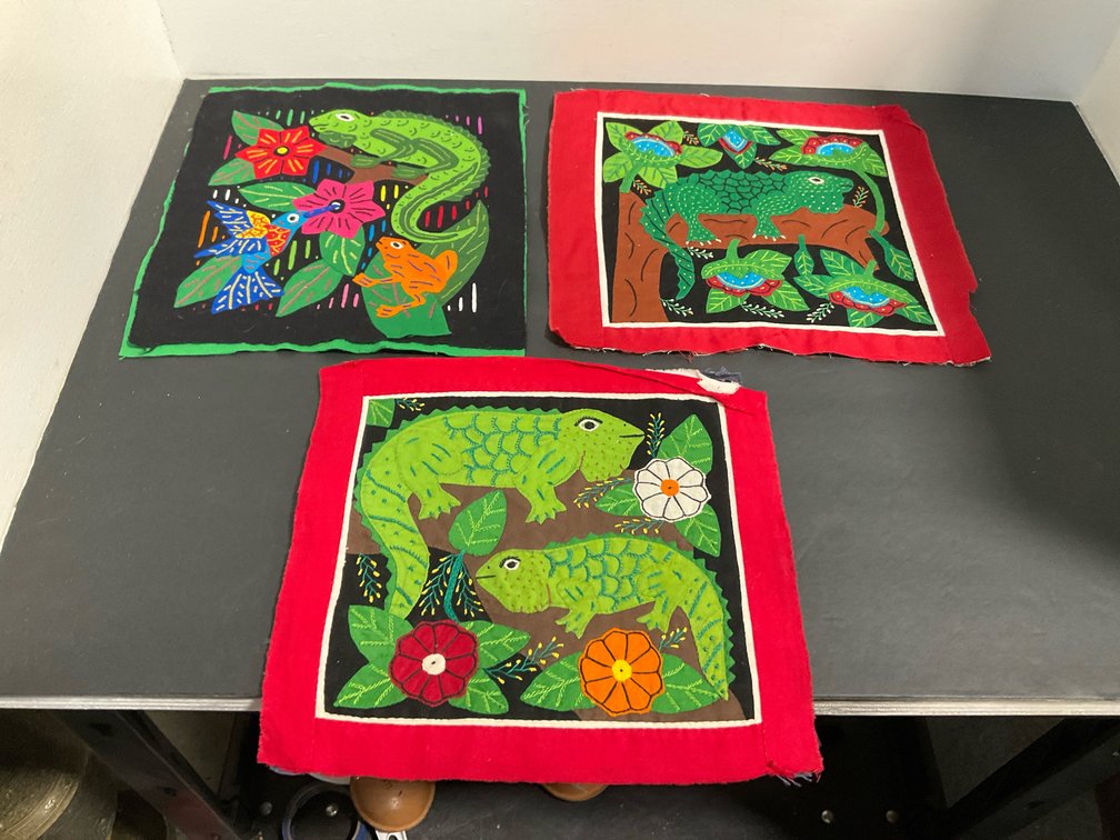 Mola applique textile panels with lizards