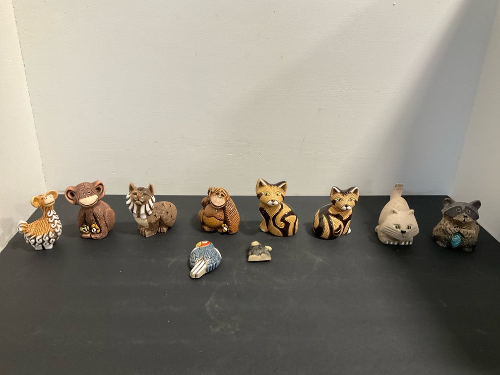 Ceramic animal figurines with glazed accents