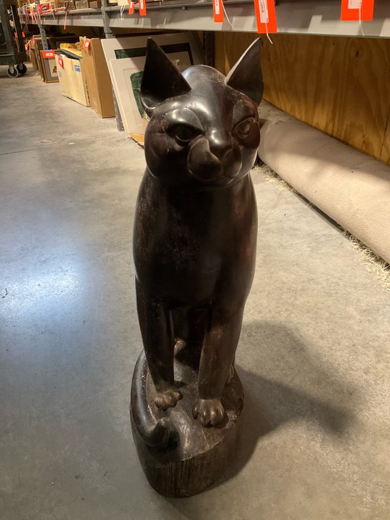 Carved dark wood seated cat sculpture