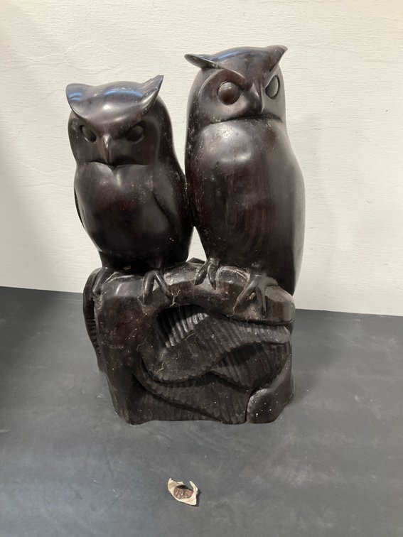 Carved dark wood double owl sculpture