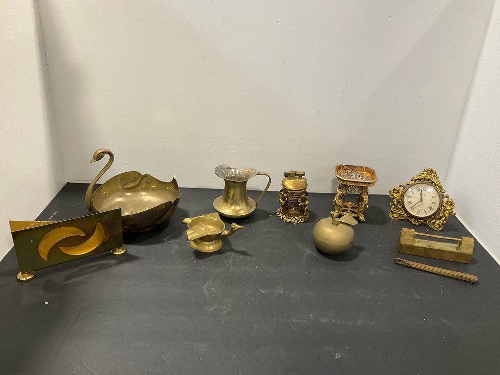 Grouping of brass tabletop decor with padlock & key