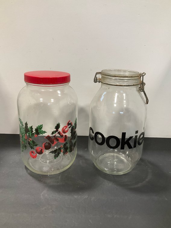 Pair of clear glass cookie jars with lids
