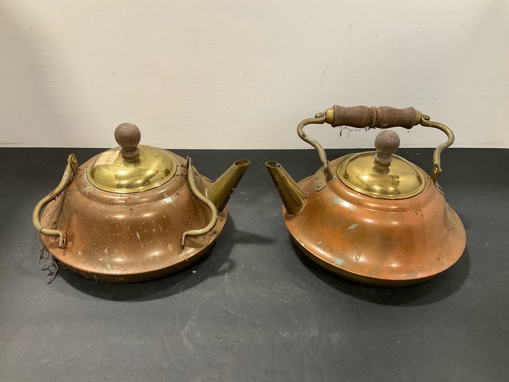 Pair of copper tea kettles with brass lids