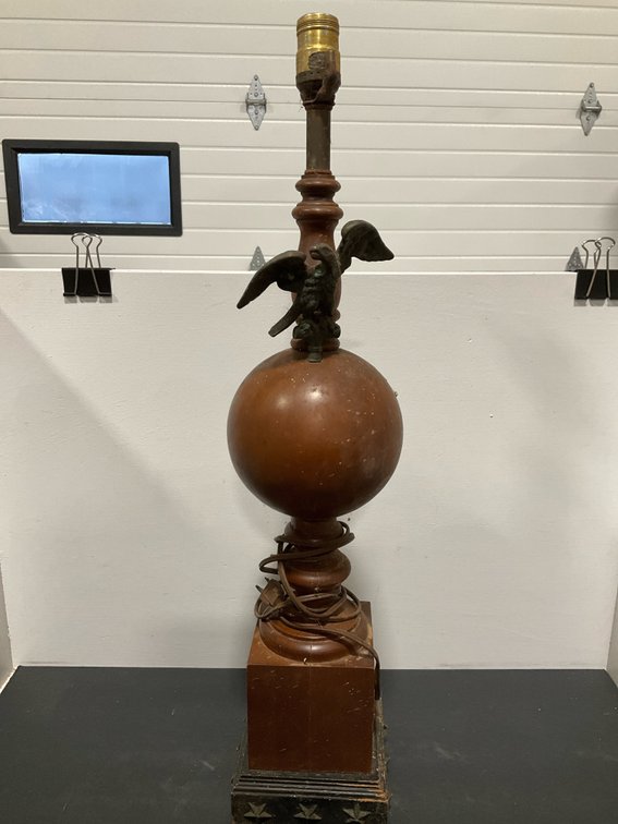 Turned wood table lamp with metal eagle and star base