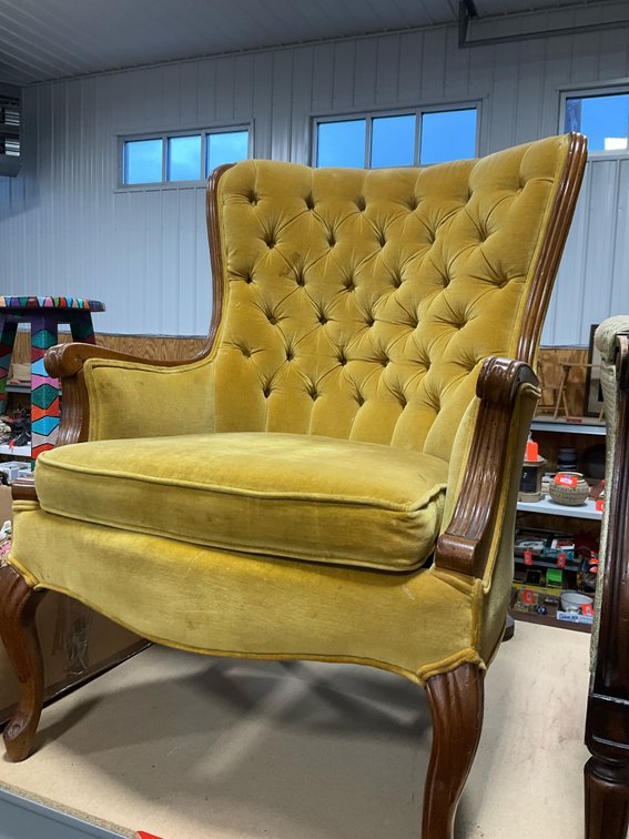 Mustard yellow tufted velvet wingback armchair