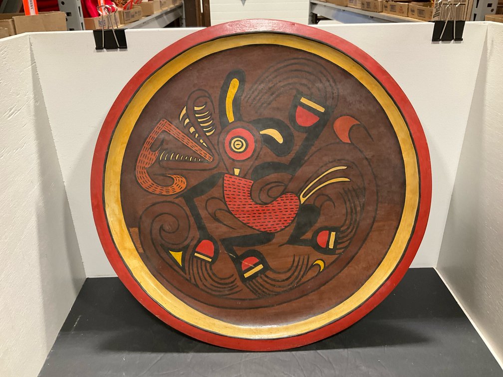 Hand-painted wooden platter with creature motif