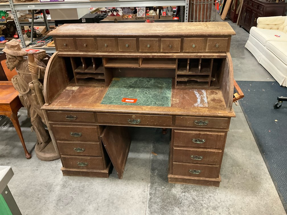 Wooden roll-top pedestal desk with green inset