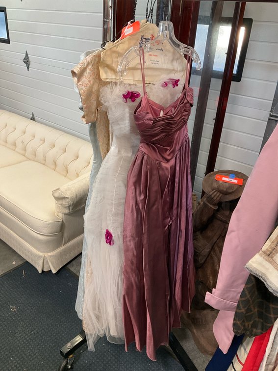 Grouping of formal dresses and evening gowns