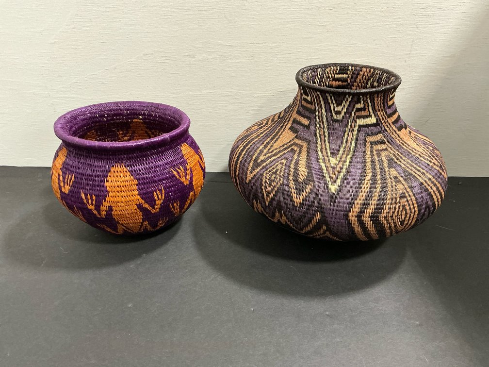 Pair of woven baskets with geometric & frog motifs
