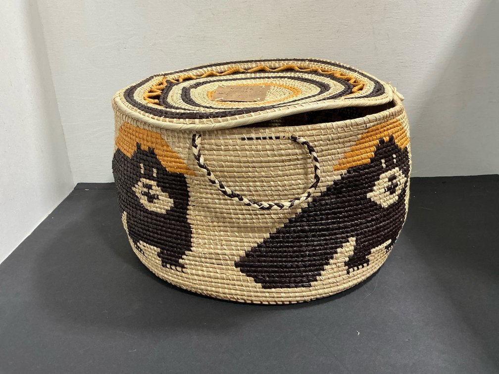 Coiled woven lidded basket with bear motifs