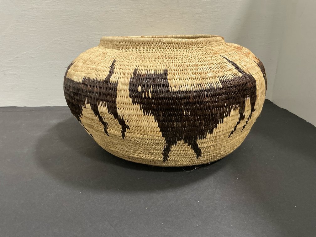 Coiled woven basket jar with animal motifs