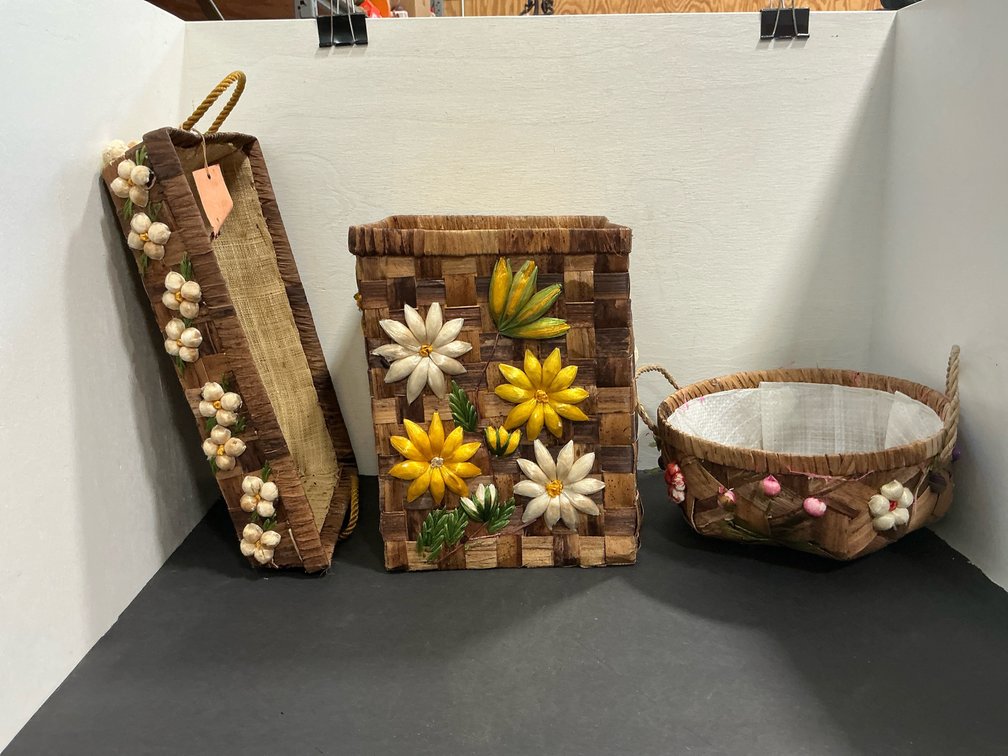 Decorative woven baskets with floral trim