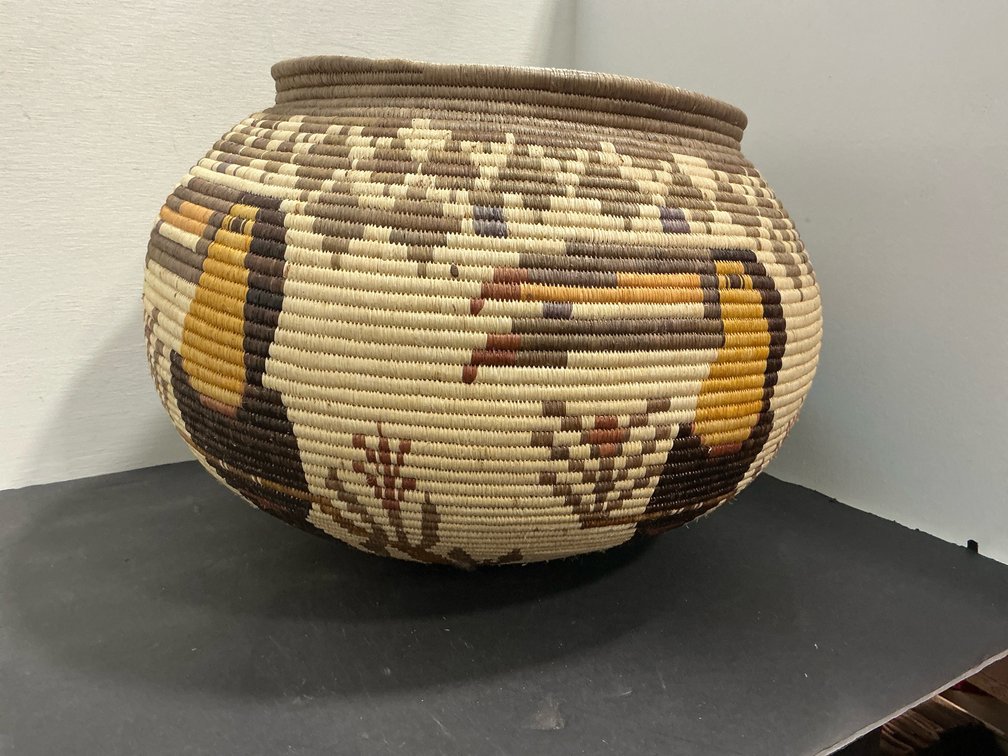 Coiled woven pictorial basket with bird motifs