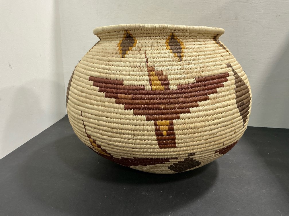 Coiled woven basket jar with bird motifs