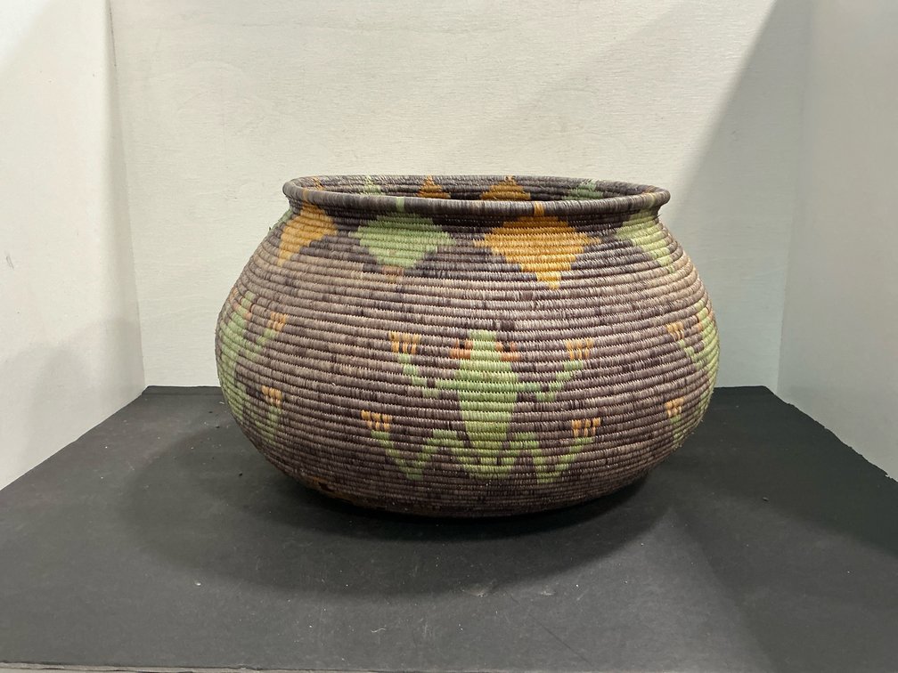 Bulbous coiled woven basket with frog motifs