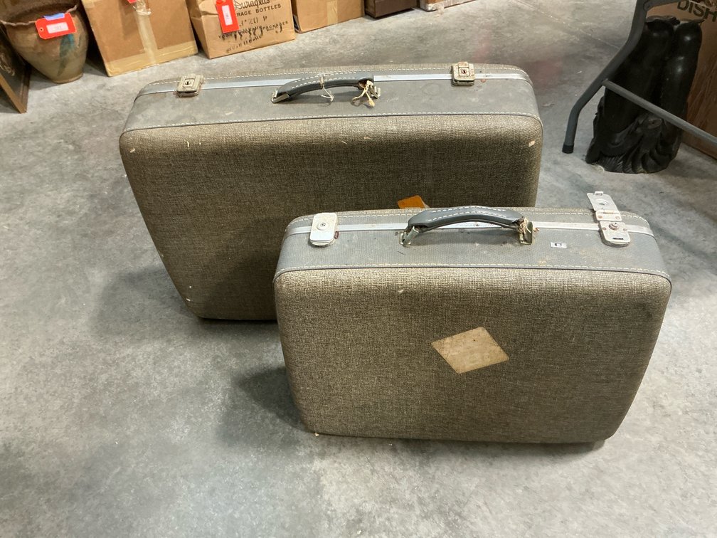 2 American Tourister graduated hard-sided suitcases