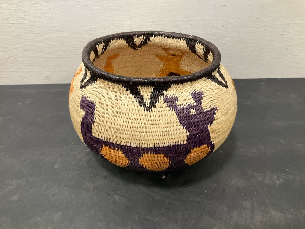 Woven coiled basket with pictorial animal motifs