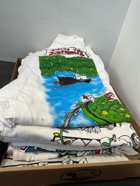 Stack of Panama Canal commemorative graphic T-shirts