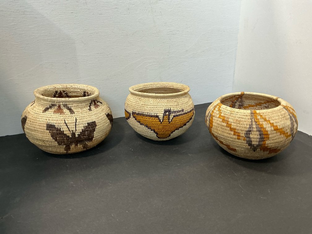 Coiled woven baskets with bird & butterfly motifs